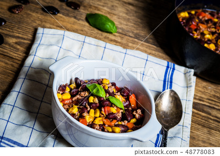Chili corn carne on wood table 48778083