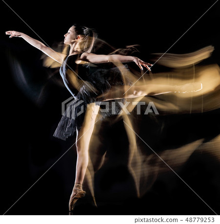 young woman ballerina  dancer dancing isolated black background light painting 48779253