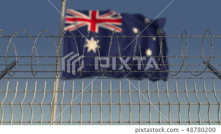 Blurred waving flag of Australia behind barbed wire fence. 3D rendering 48780200
