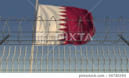 Blurred waving flag of Qatar behind barbed wire fence. 3D rendering 48780269