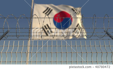 Barbed wire against waving flag of South Korea. 3D rendering 48780472
