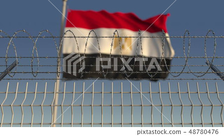 Blurred waving flag of Egypt behind barbed wire fence. 3D rendering 48780476