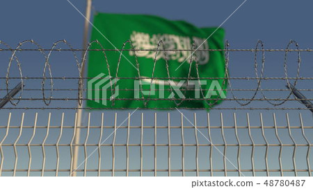 Barbed wire against waving flag of Saudi arabia. 3D rendering Barbed wire against waving flag of Saudi arabia. 3D rendering 48780487