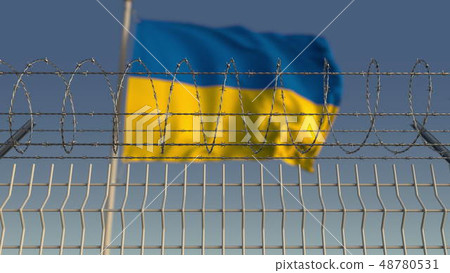 Blurred waving flag of Ukraine behind barbed wire fence. 3D rendering 48780531