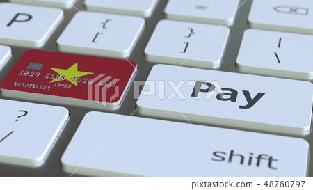 Bank card featuring flag of Vietnam as a key on a computer keyboard. Vietnamese online payment Bank card featuring flag of Vietnam as a key on a computer keyboard. Vietnamese online payment 48780797