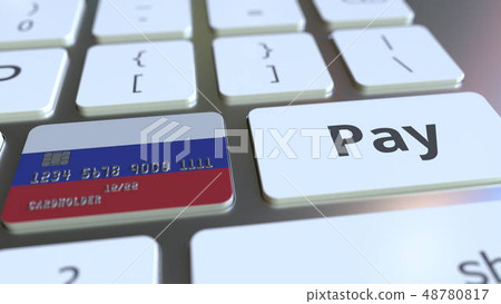 Bank card featuring flag of Russia as a key on a computer keyboard. Russian online payment 48780817