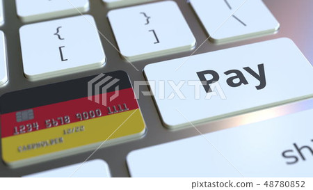 Bank card featuring flag of Germany as a key on a computer keyboard. German online payment 48780852