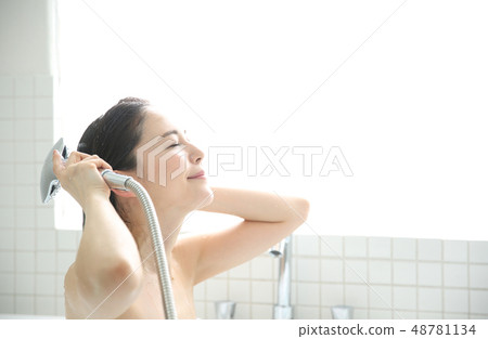 Woman taking a shower 48781134