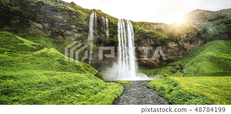 Magical Seljalandsfoss Waterfall in Iceland. Magical Seljalandsfoss Waterfall in Iceland. 48784199