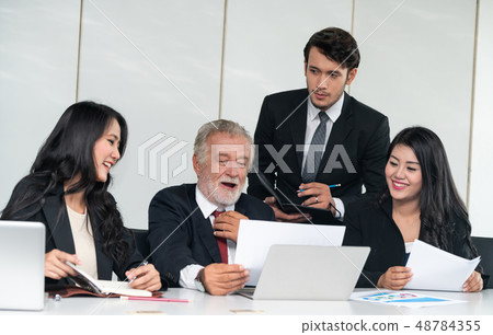 Business people, manager and employee in meeting. 48784355