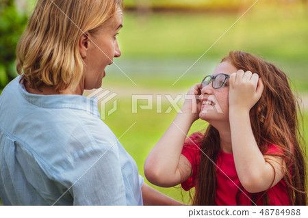 Happy family is on vacation in public park. Happy family is on vacation in public park. 48784988