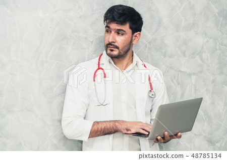 Doctor using laptop computer at the hospital. Doctor using laptop computer at the hospital. 48785134