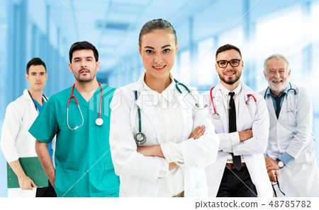 Doctor working in hospital with other doctors. 48785782