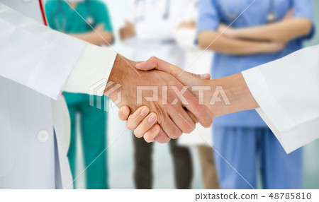 Doctor working in hospital with other doctors. Doctor working in hospital with other doctors. 48785810