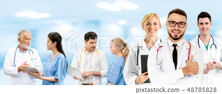 Doctor working in hospital with other doctors. 48785828