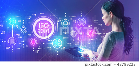 ISO 9001 with woman using a tablet ISO 9001 with woman using a tablet 48789222