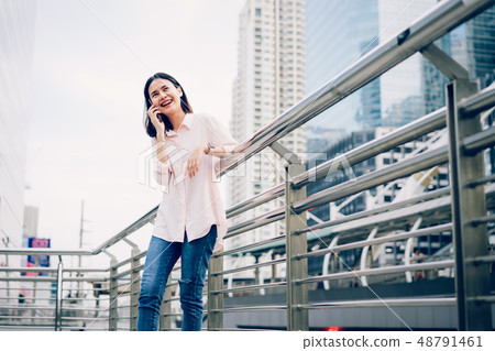 Young girl calling with smartphone and smile. Young girl calling with smartphone and smile. 48791461