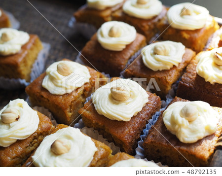 Slice of carrot cake with cream cheese frosting Slice of carrot cake with cream cheese frosting 48792135