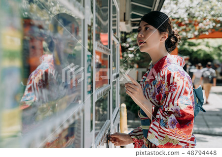 thirsty japanese lady in hot summer insert coins 48794448