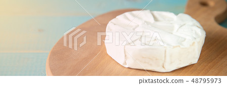 Cheese camembert or brie with walnut kernels Cheese camembert or brie with walnut kernels 48795973