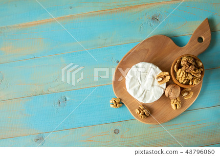 Cheese camembert or brie with walnut kernels Cheese camembert or brie with walnut kernels 48796060
