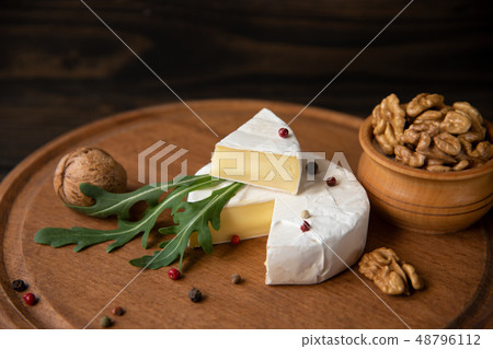 Cheese camembert or brie with walnuts and arugula Cheese camembert or brie with walnuts and arugula 48796112