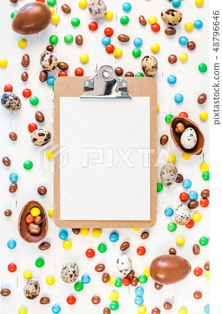 Easter frame with chocolate eggs, colorful candies Easter frame with chocolate eggs, colorful candies 48796646