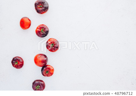 Tomatoes Mar Azul on white wooden table background Tomatoes Mar Azul on white wooden table background 48796712