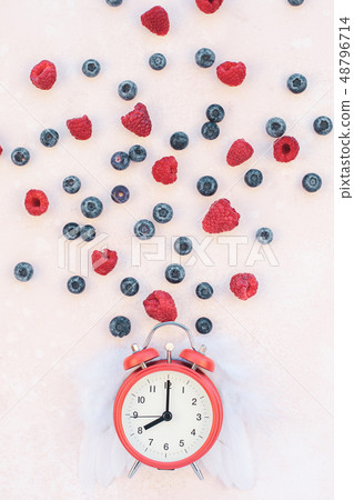 Valentine Day composition berries alarm clock 48796714
