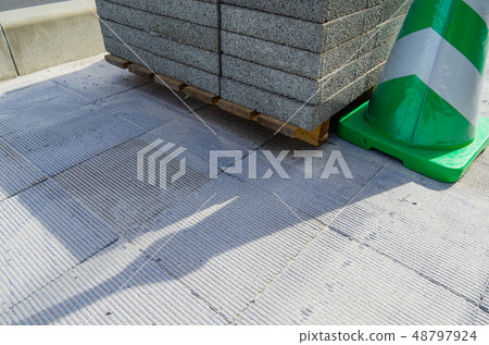 Sidewalk under construction block paving a Sidewalk under construction block paving a 48797924