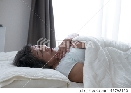 Poor senior woman suffering pain Poor senior woman suffering pain 48798190