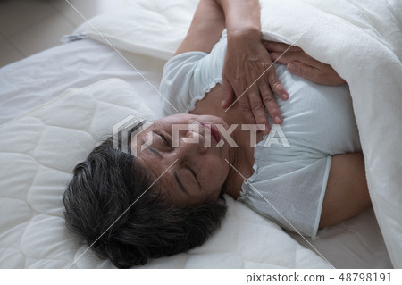 Poor senior woman suffering pain Poor senior woman suffering pain 48798191