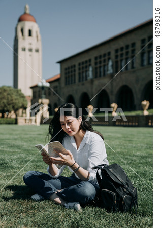 college girl sitting outdoor in university 48798316