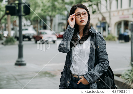 beautiful woman standing on road. beautiful woman standing on road. 48798364