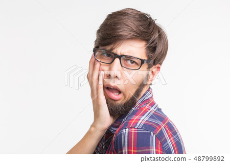 Expression and gesture concept - Handsome man with awkward face Expression and gesture concept - Handsome man with awkward face 48799892