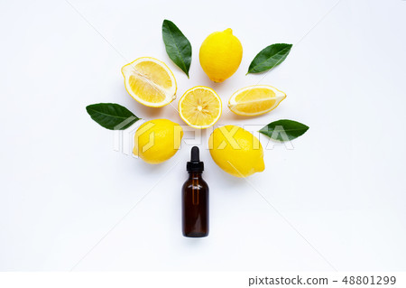 Fresh lemon with lemon essential oil on white Fresh lemon with lemon essential oil on white 48801299