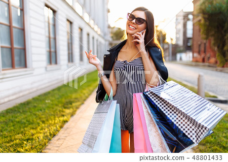 A young girl enjoys a successful shopping 48801433