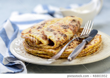 Homemade potato pancakes lefse on a plate. Homemade potato pancakes lefse on a plate. 48801932