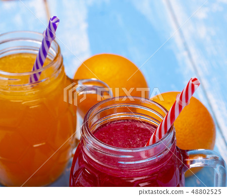 The Two glass vessel with the juice of orange and 48802525