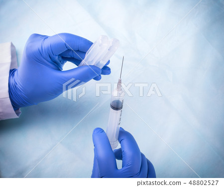 The small syringe, medicine and doctor. 48802527