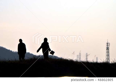 People enjoying a walk on Saturday evening People enjoying a walk on Saturday evening 48802805