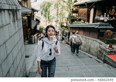 girl smiling walking up stairs in sannen zaka girl smiling walking up stairs in sannen zaka 48802849