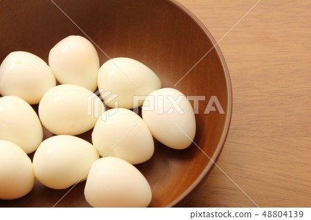 Quail egg. The shell is peeled off after boiling. Quail egg. The shell is peeled off after boiling. 48804139