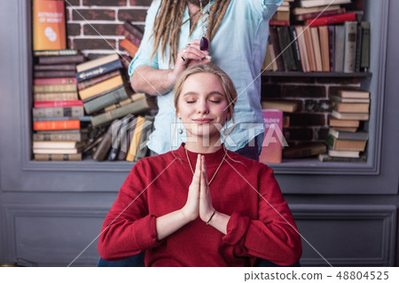Delighted good looking woman closing her eyes 48804525