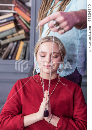 Special necklace in front of the womans face 48804540