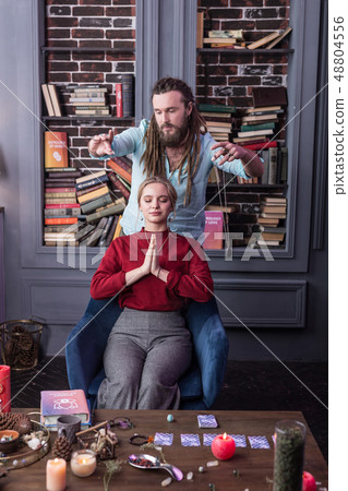 Attractive calm woman sitting on the chair 48804556