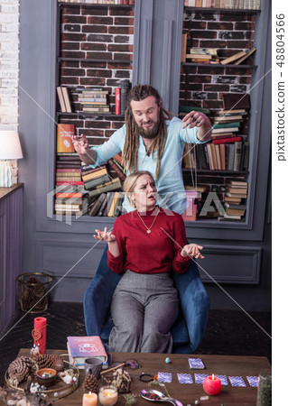 Nice bearded man trying to hypnotize the woman 48804566