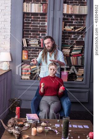 Nice good looking man standing behind his client 48804602