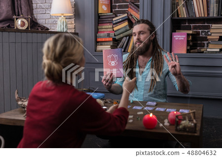 Nice good looking man speaking about the book 48804632