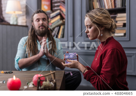 Pleasant serious woman focusing on her questions 48804665